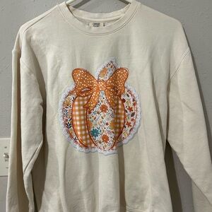 Comfort Colors Cream Shirt with Orange Lace Pumpkin Design